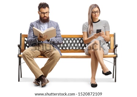 Man reading a book and woman sitting on a bench and typiing on a mobile phone isolated on white background Royalty-Free Stock Photo #1520872109