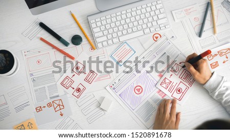 Website designer creates a sketch application. Developing a project drawing an interface mockup.