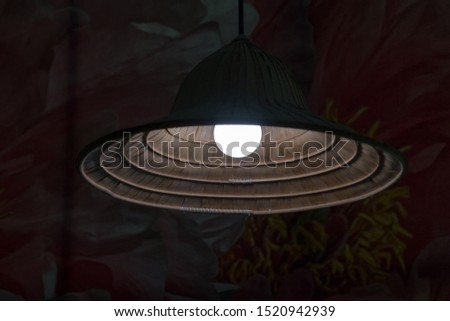 Hanging lamp with drawing picture background.