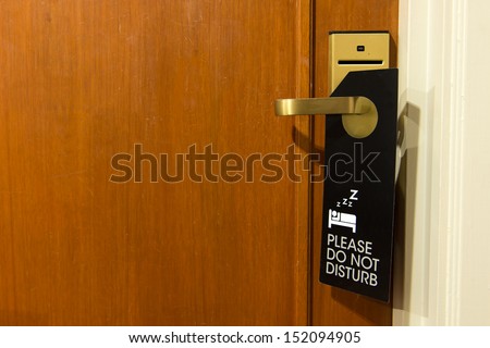 Do not disturb sign hang on door knob Royalty-Free Stock Photo #152094905