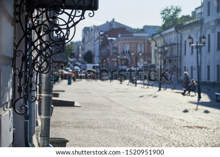 Blurred photo of the city street on a Sunny summer day for the background
