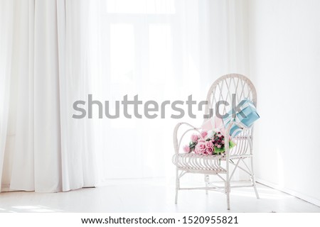 white vintage chair in the interior of an empty white room