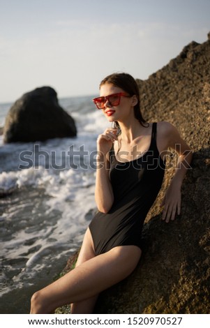 young blue ocean woman resting in a swimsuit