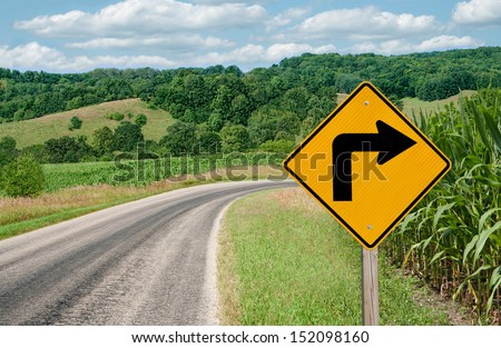 Right Turn Sign:  A sign warns of a sharp right turn on a country road in southern Wisconsin.  Royalty-Free Stock Photo #152098160