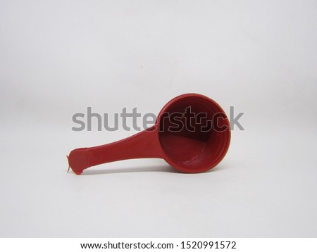 Red mini small gayung or bucket, scoop, bailer,water dipper use for children play toys sand or a tool to take water that is usually found in the bathroom. made of cheap plastic material that is light 