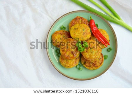 Perkedel, Indonesian fried mashed potato minced beef patties garnish with parsley and red chili
