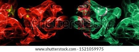 China vs Turkmenistan, Turkmenistans smoke flags placed side by side. Thick colored silky smoke flags of Chinese and Turkmenistan, Turkmenistans