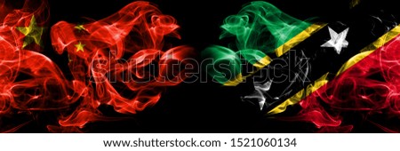 China vs Saint Kitts and Nevis smoke flags placed side by side. Thick colored silky smoke flags of Chinese and Saint Kitts and Nevis