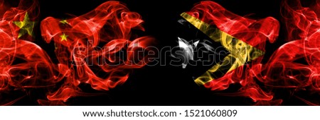 China vs East Timor smoke flags placed side by side. Thick colored silky smoke flags of Chinese and East Timor