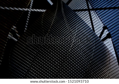 Double exposure photo of office building exterior fragment with corrugated wall panels. Abstract material background on the subject of modern architecture, construction industry or technology.