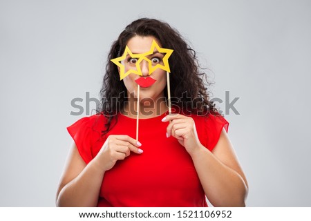 party props, photo booth and people concept - funny woman with star shaped glasses and red lips over grey background