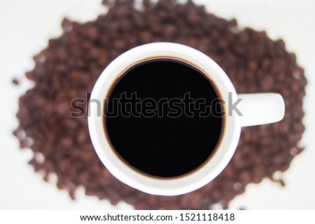 The top image of the coffee in a white mug.