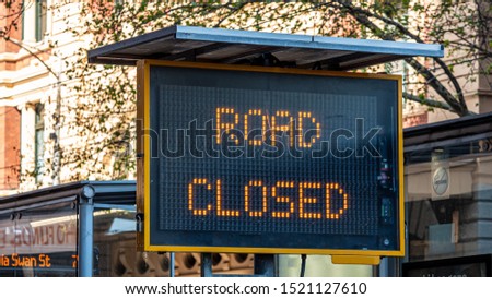 Road closed electronic sign in a city road. Royalty-Free Stock Photo #1521127610