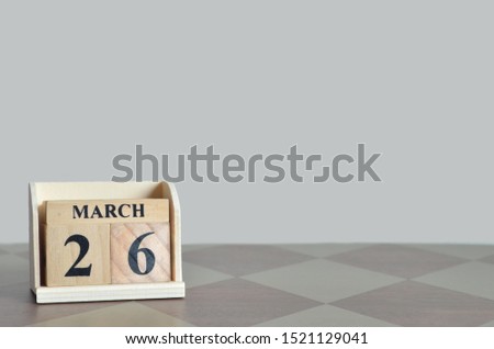 Empty Background with number cube on the table, March 26.