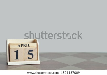 Empty Background with number cube on the table, April 15.
