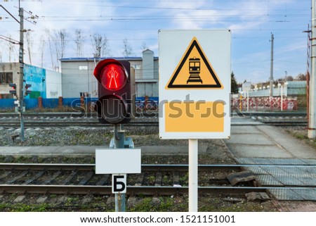 red signal of simophore near the railway tracks