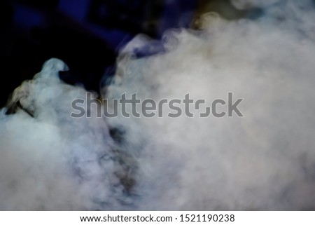 Blurred white smoke on a black background Smoke surface