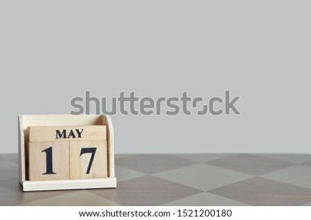 Empty Background with number cube on the table, May 17.