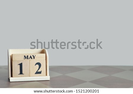 Empty Background with number cube on the table, May 12.