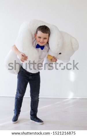 Beautiful boy with toy big polar bear