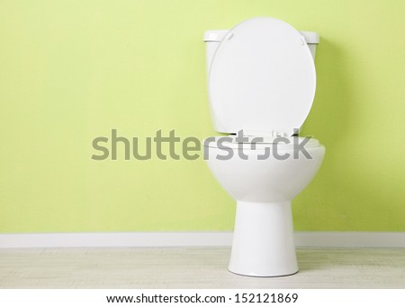 White toilet bowl in a bathroom Royalty-Free Stock Photo #152121869