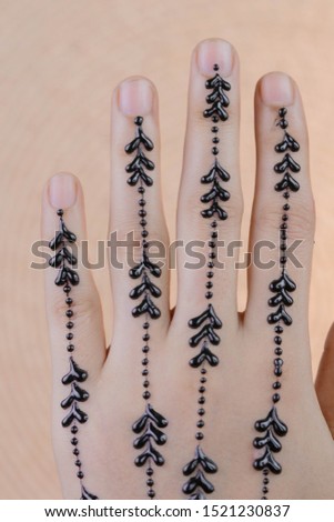 girl back hand henna design 
