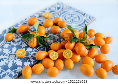 Citrus fruits kumquat with gray and blu background