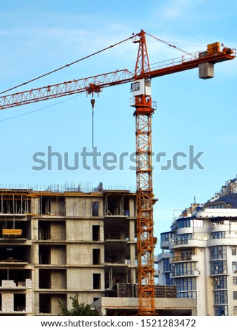 Construction site with crane. Construction of the multi-storey building. Industrial background.