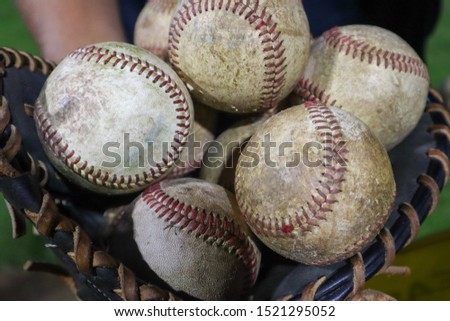 bunch of baseballs in glove baseball