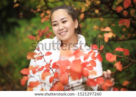 portrait of a girl in the autumn Park closeup