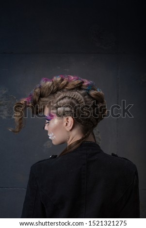 hairstyle for halloween. art make-up sugar skull, model shooting. A girl with black hellish eyes. Hairdressing. Hairstyle with colored sparkles. Beauty saloon. hairstyle contest