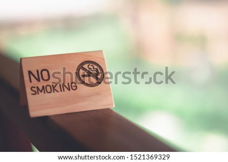 No smoking on the wooden tables on the balcony of the room.