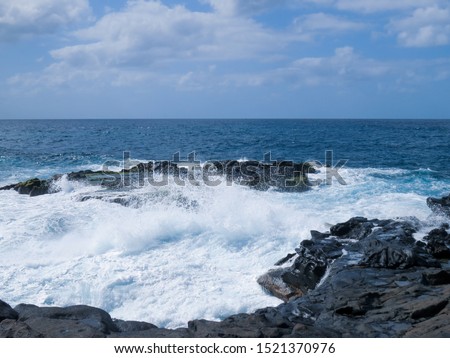 Coastal landscape of the town of El Puertillo, Gran Canaria Island, Spain. Rugged landscape modeled by the waves on the volcanic rocks.