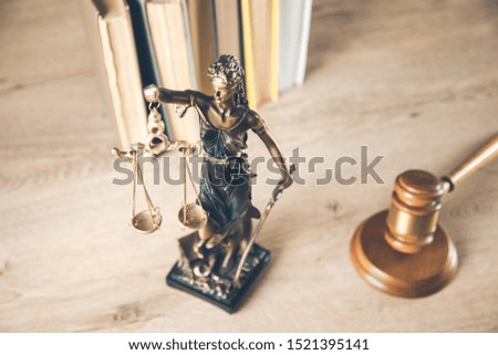 justice lady with judge and books on desk