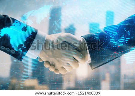 Double exposure of world map on cityscape background with two businessmen handshake. Concept of international business