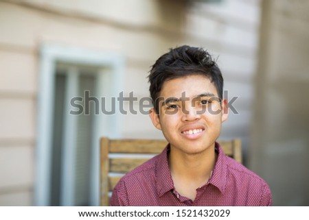 Portrait of a young mixed race teenage boy. Royalty-Free Stock Photo #1521432029