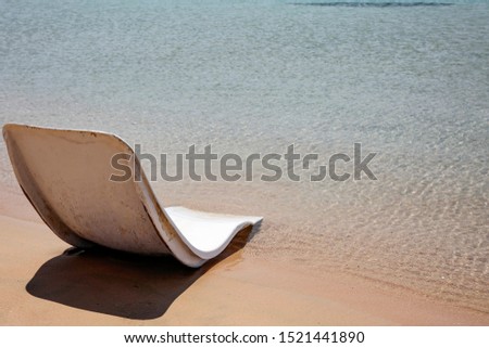White summer chair on beach and free space for your decoration 