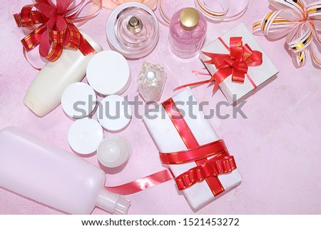Sale, black friday, a set of creams for skin care and gift bags on a pink background, flat lay, top view. Concept of shopping and modern woman, place for text