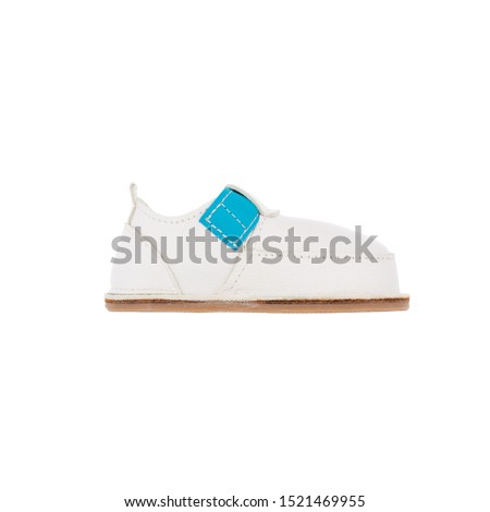 white leather baby shoes isolated on perfect white background, stock photography