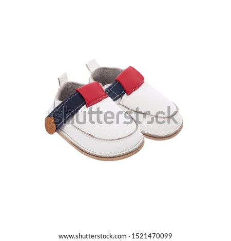 white leather  baby shoes isolated on perfect white background, stock photography