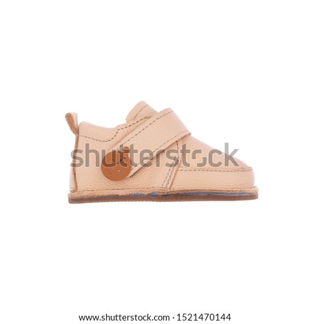 cream leather  baby shoes isolated on perfect white background, stock photography