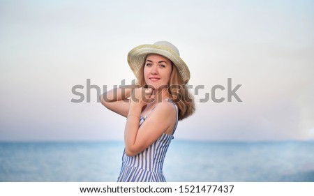 Beautiful young girl by the sea. Portrait of a girl. Summer