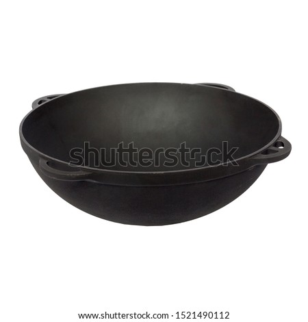 black empty cast iron wok isolated  on perfect white background, stock photography