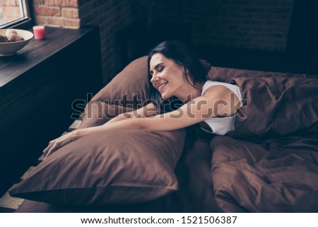 Portrait of her she nice attractive lovely lovable charming cute winsome pretty cheerful cheery girl lying in bed stretching industrial brick loft style interior room flat apartment house indoors