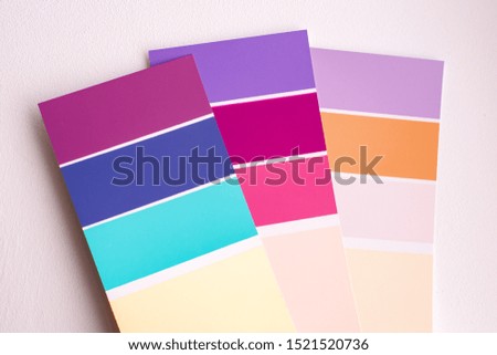 Color palette with various samples. Light background. Paint selection cards, close-up