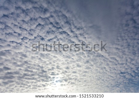 Background image - tall autumn sky in white cotton-like clouds.