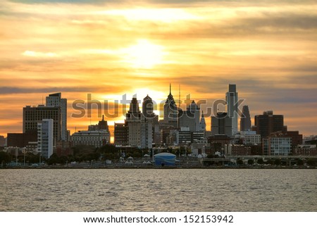 Downtown Center City Philadelphia scenic skyline with skyscraper buildings and Old City historic landmarks on the Delaware River at Sunset