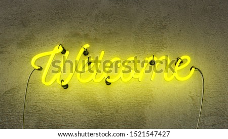 Neon sign that says the word Welcome in bright yellow colours, on a grunge  concrete wall background.