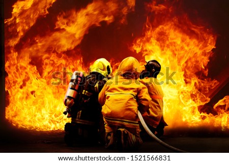 fireman wearing fire fighter suit for safety under danger situation to fighting with flame in an emergency situation, firefighter training