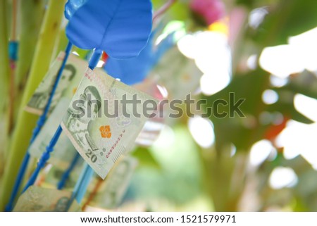 Thai money on the money tree at the annual Kathin ceremony, this ceremony, people will make merit by giving money trees to the temple.